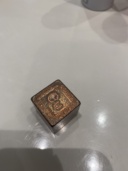 A copper cube measuring 25.4mm (1") on each side, purchased from a metaphysical store. The text around the square reads, clockwise from the top: COPPER / 8.92 g/cc / 5 OUNCES / 1085°C. The square icon itself reads: 29 / Cu / 63.55.