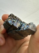 100 gram Vanadium metal chunk, showing blue, green, gold, and purple colors resulting from a thin layer of oxidation.