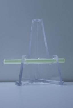 A small amount of radioactive Tritium (Hydrogen with one proton and two neutrons) in a tube that has been coated on the inside with a phosphor. The radioactivity of the Tritium causes the phosphor coating to glow green in the dark.