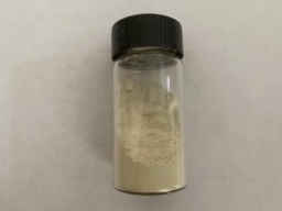 Finely powdered yellow Sulfur in a bottle. Clumps have formed.