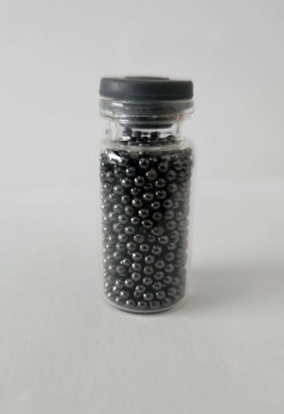 Countless tiny, dark, shiny Lead shot in a bottle