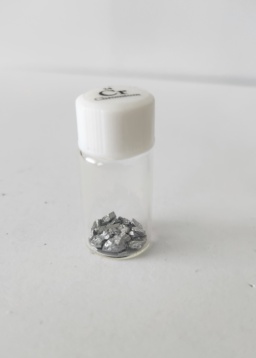 A small amount of tiny Chromium pieces in a small bottle with lid