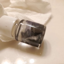 Small pieces of Neodymium in a bottle