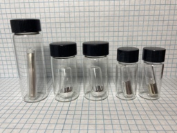 The Alkali Metals group: |li| rod, |na|, |k|, |rb|, and |cs|. All samples are inside ampoules, because these elements are extremely reactive to the |o| in air.