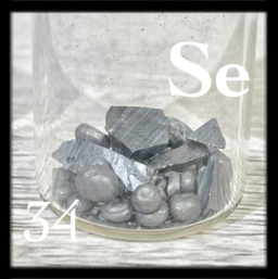 Smooth chunks and dark gray pellets of Selenium