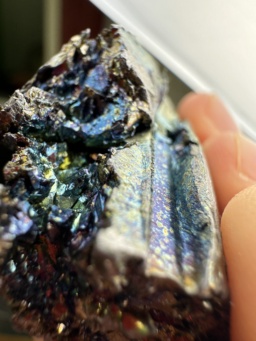 100 gram Vanadium metal chunk, showing blue, green, gold, and purple colors resulting from a thin layer of oxidation.