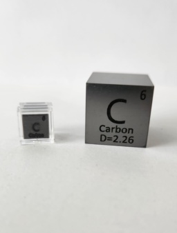 Two Carbon cubes: 1 cm cube on the left inside a clear container, 1 inch cube on the right