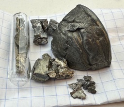 Four chemical elements were named after the town of Ytterby, Sweden, where many rare-earth elements were discovered from the ores mined there. In this photo is |y| (large chunk), |yb| (in ampoule), |tb| (brassy pieces), |er| (silvery pieces). Also included are small pieces of dull, slightly oxidized |ho|, which takes the name of Stockholm, Sweden.