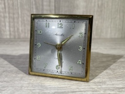 A Mauthe brand alarm clock with Radium paint. First photo in the daylight, second photo in the dark showing the glow more easily.