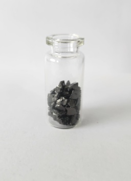 Small pieces of glassy Carbon filling 1/2 of a small jar