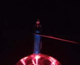 Near a plasma globe, Chlorine glows a dim blue-indigo color