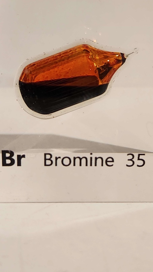 Bromine in an ampoule itself embedded in an acrylic cube