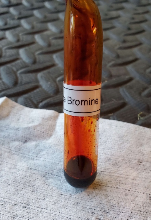 Three separate sealed ampoules of liquid and gaseous Bromine