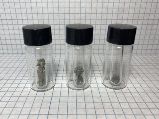 Small pieces of |sc|, |y|, and |lu|. In the past, it was debated whether these three elements are transition metals or rare-earth metals, but the consensus now is they're all rare-earth metals.