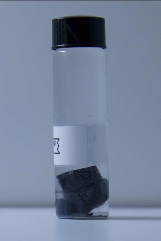 4 grams of tarnished |pr| metal in a bottle