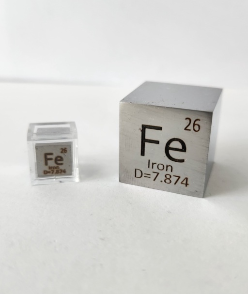 Two cubes of polished Iron: a 1 cm cube on the left in a clear case, and a 1 inch cube on the right