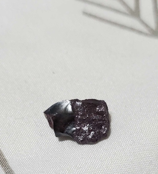 Small piece of Violet Phosphorus. This piece appears to be a dark purple color.