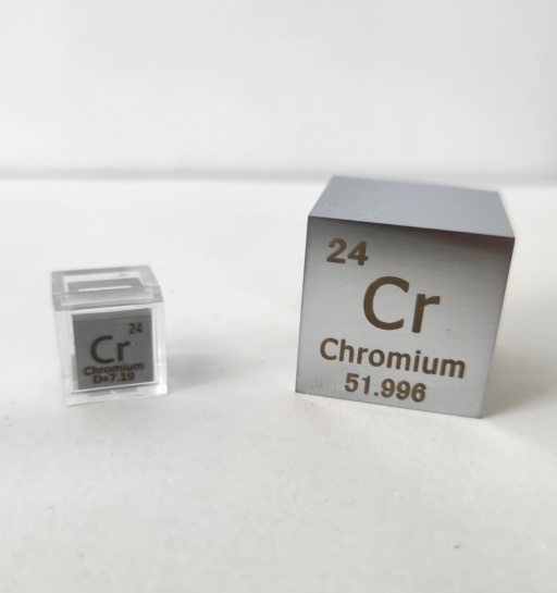 Two Chromium metal cubes: a 1 cm cube in a clear case on the left, and a 1 inch cube on the right.