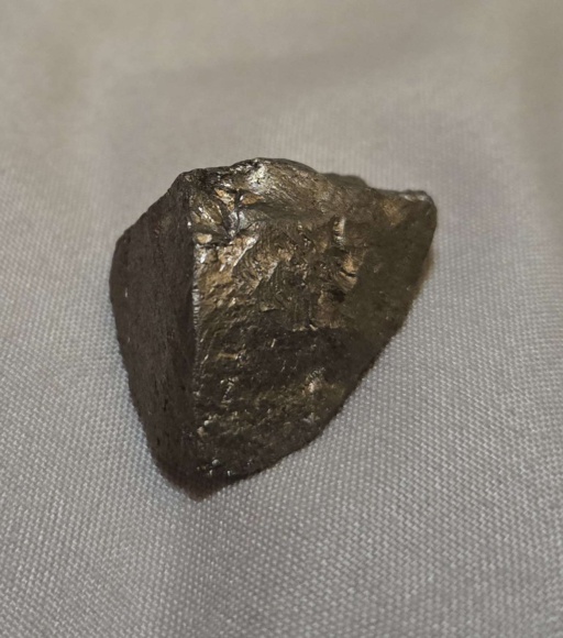 Heavily oxidized chips of Manganese, and a large slightly-brassy-tarnished chunk of Manganese