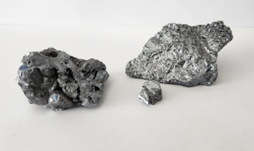 Three chunks of Silicon: two larger chunks and a very small chunk