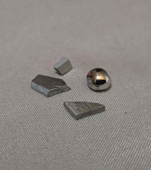 Three small chunks and a bead of Ruthenium